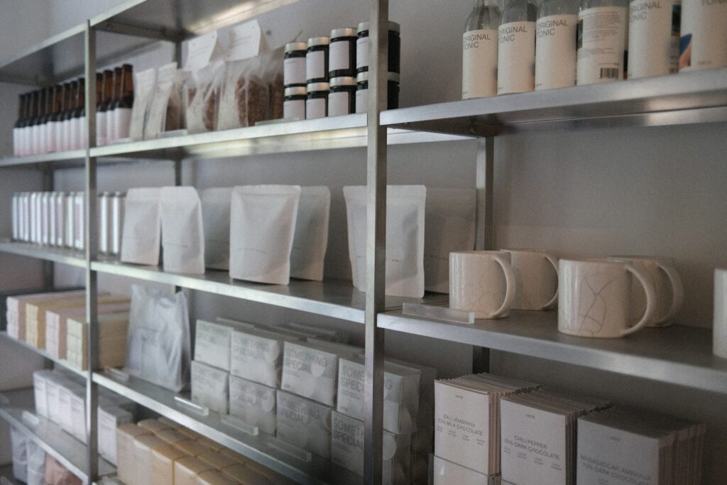 a shelf with many white containers on it